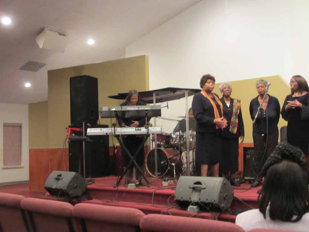 Rev. Brenda Boone's Higher Praise Community Choir of Hampton Roads.  Rev. Boone at the keyboards.